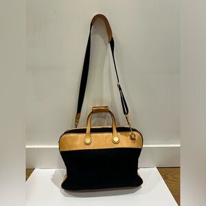 Dooney and bourke black canvas and leather bag with shoulder strap
